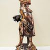 Escultura señora de cobre
