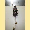 Reloj de pared con pesas