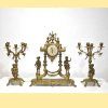 Reloj y candelabros bronce