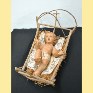 Figura Niño en cuna de madera
