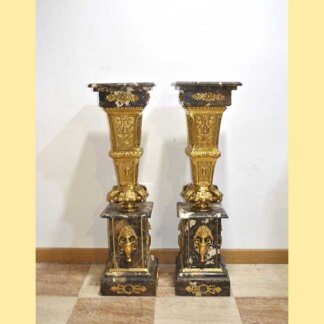 Columnas bronce y mármol