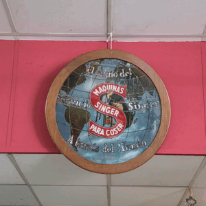 Cartel publicitario Singer