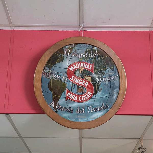 Cartel publicitario Singer